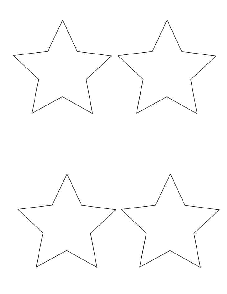 Child placing colorful tissue paper inside a black paper star frame