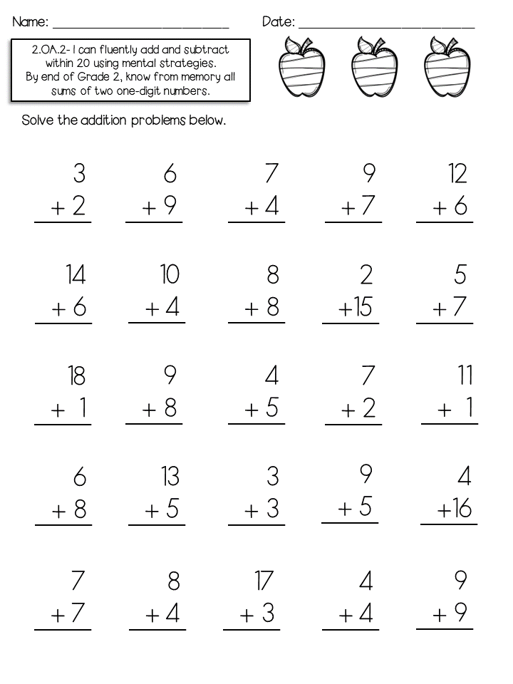 Handheld manipulative tools arranged next to a subtraction workbook