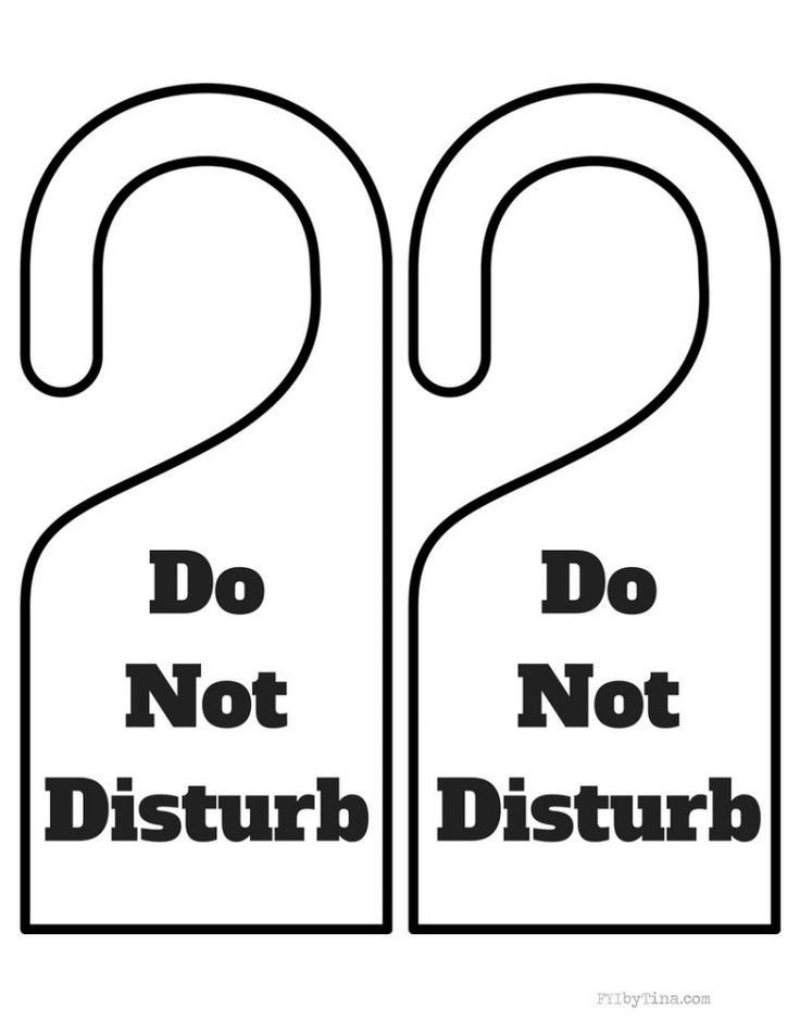 A colorful laminated sign hanging on a home office door