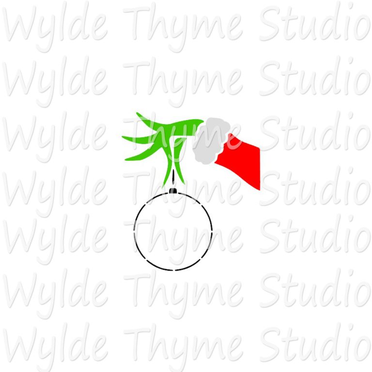 A close up of a lime green paper cutout featuring a mischievous long-fingered Grinch hand