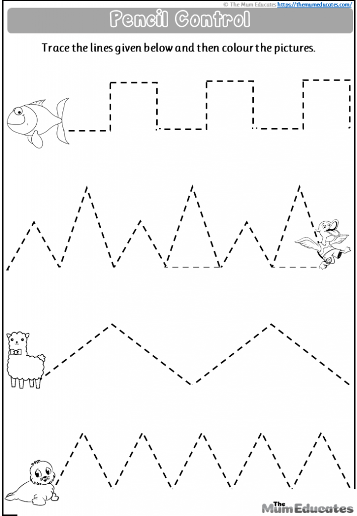 A close up view of a child carefully tracing lines on a paper worksheet