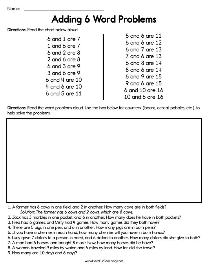 A student carefully writing a math equation on a paper worksheet