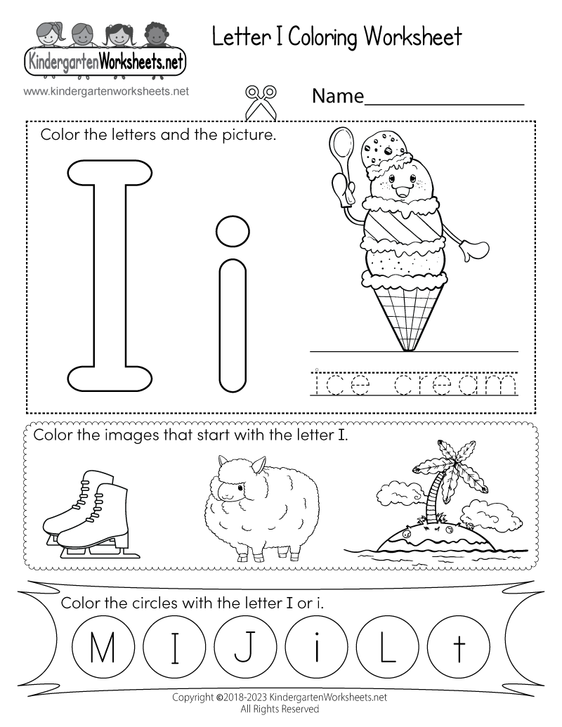 Close up of a child using a crayon to color a letter i