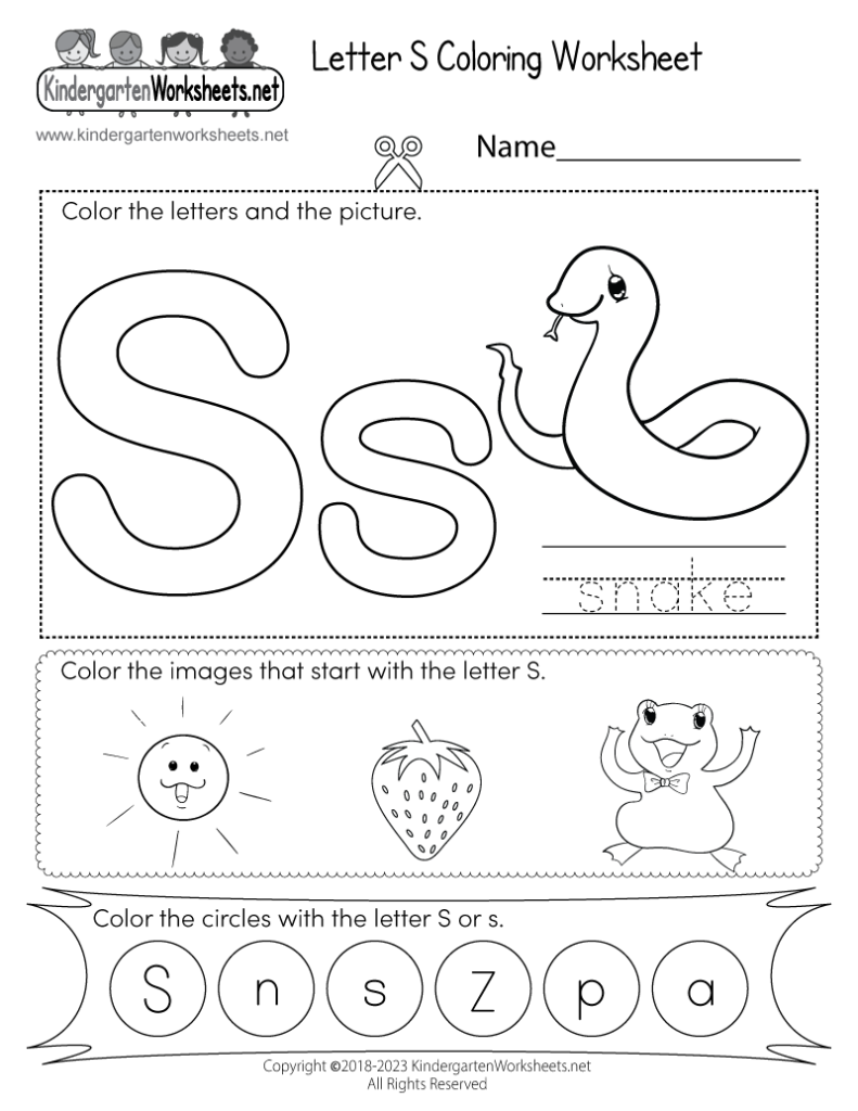 Close up of a child pointing to a picture of a sun on an alphabet worksheet