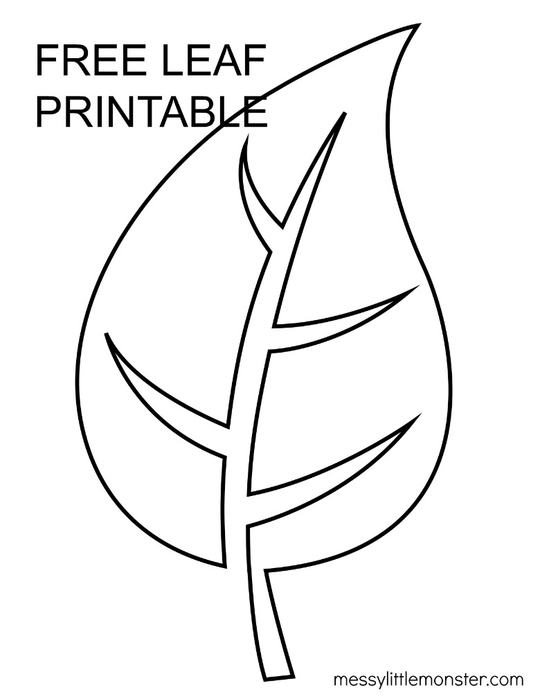 A teacher assisting a young student with cutting out a large paper leaf