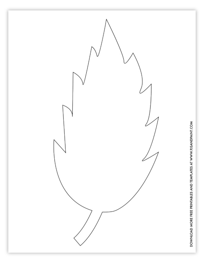 Several paper leaf cutouts spread across a wooden table surface