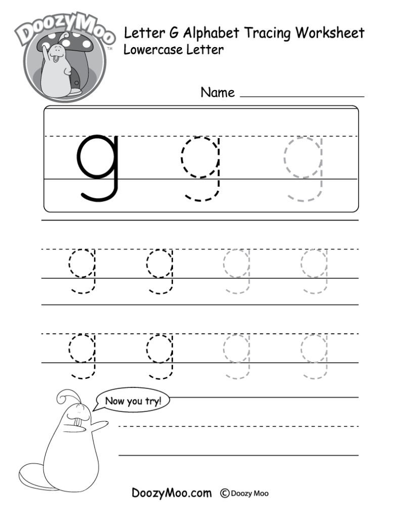 A child's hand using an eraser to fix a mistake on a school worksheet.