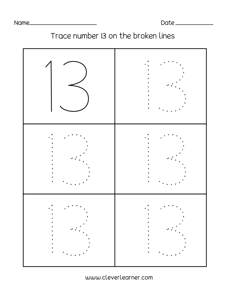 Close-up of a child holding a crayon to trace numbers on a worksheet