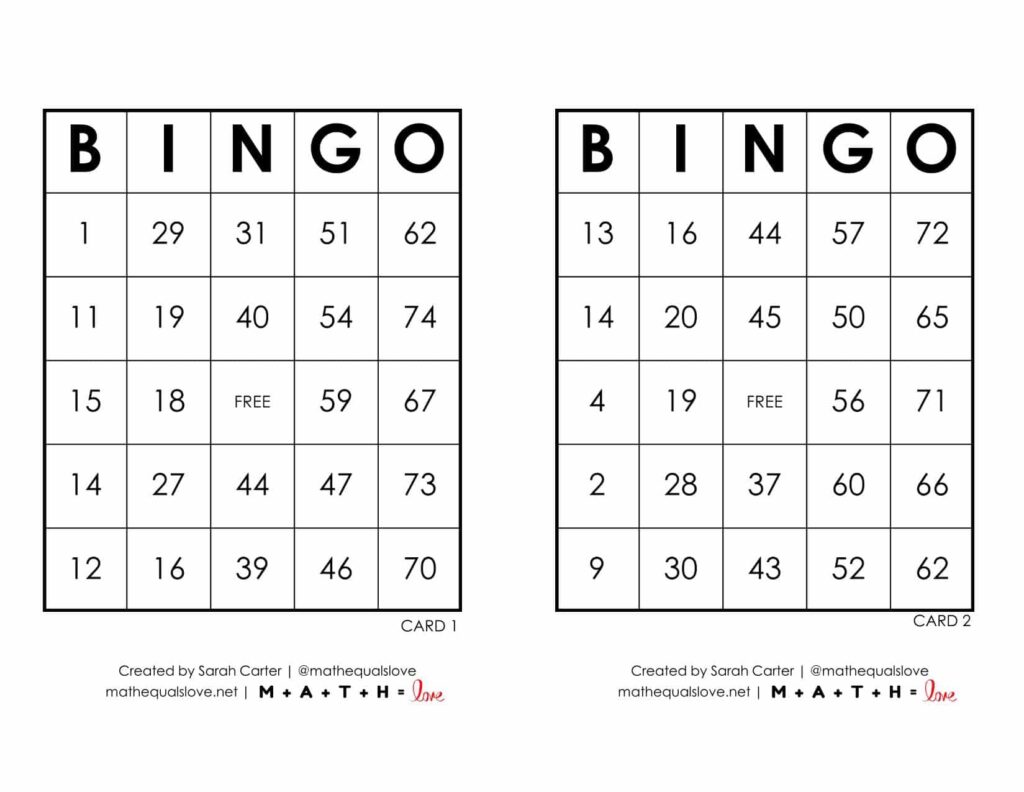 Laminated bingo cards with dry erase markers on a wooden desk