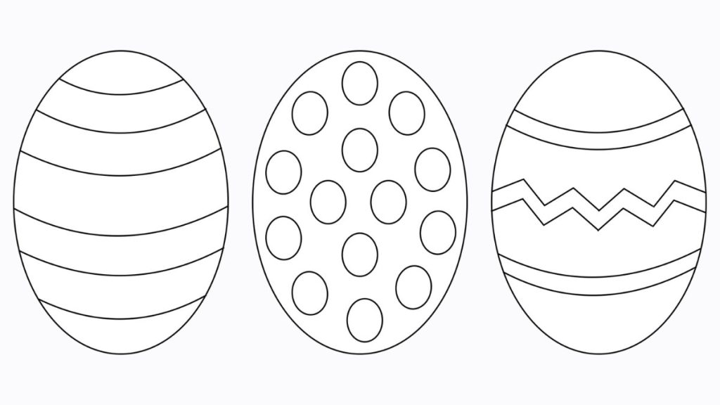 Student holding a complex, patterned egg cutout during an art project