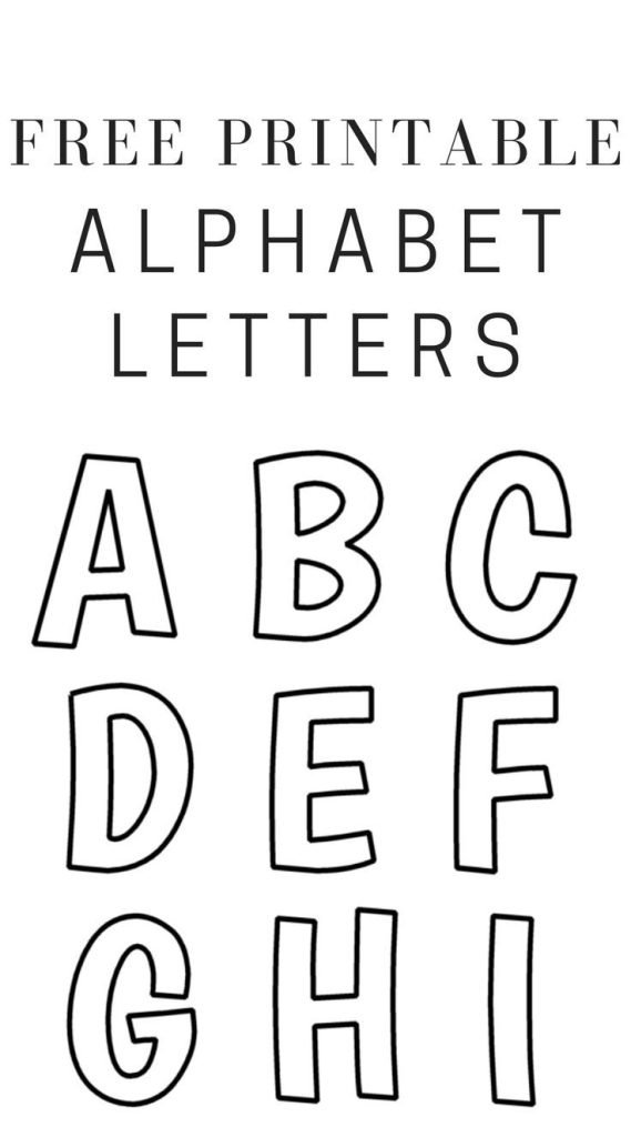 Close up of a child using a colorful pencil to trace letters on a paper template.