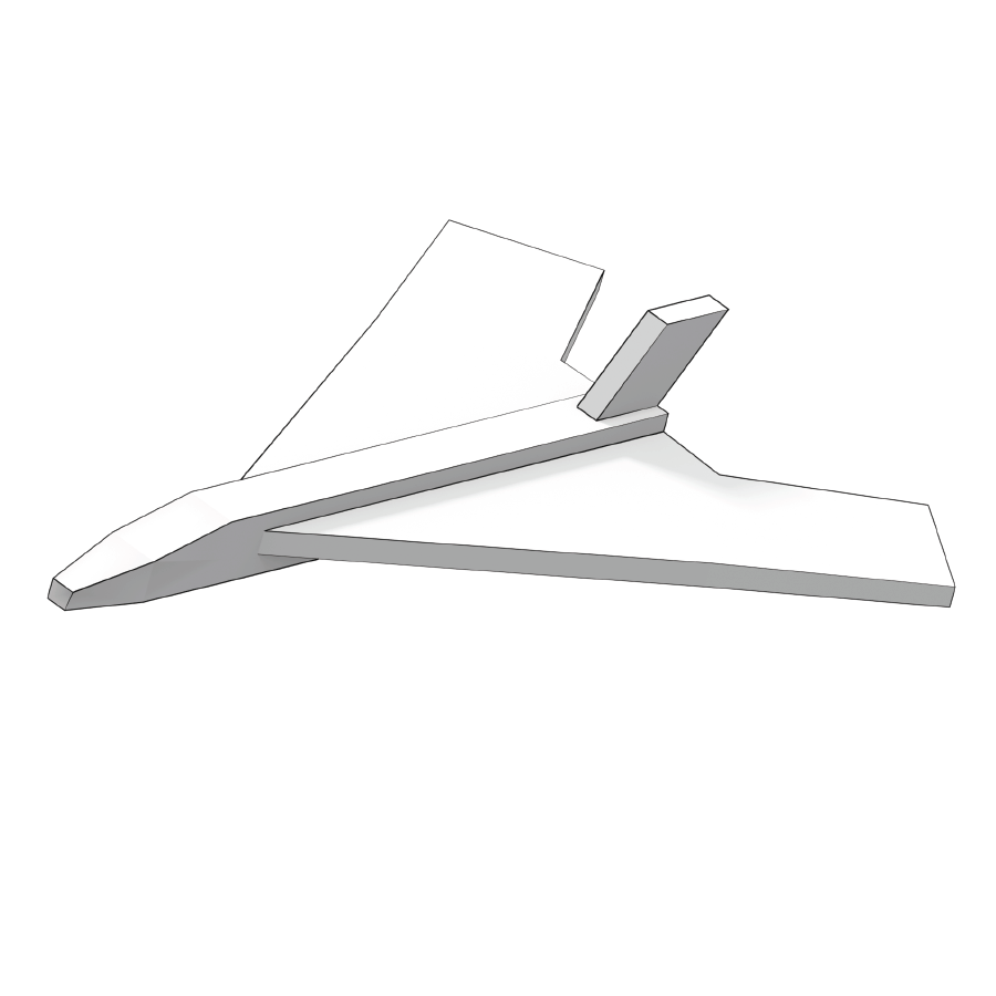 Student holding a colorful paper airplane model near a classroom desk