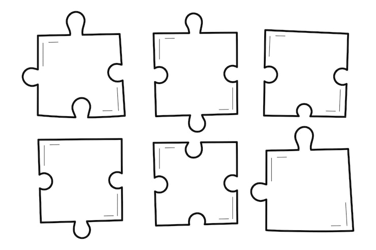 Close up of a blank jigsaw puzzle template on white paper