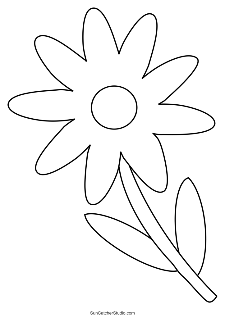 Child coloring a large black and white floral petal sheet